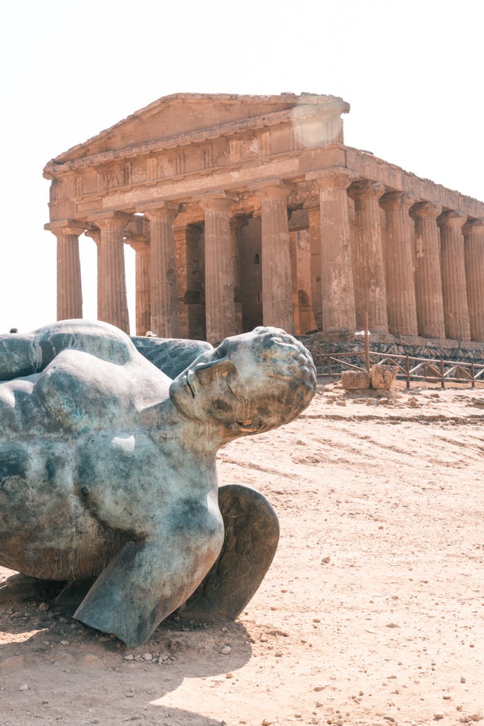 Bronze Icarus statue by the ancient Temple of Concordia in Agrigento, Sicily.