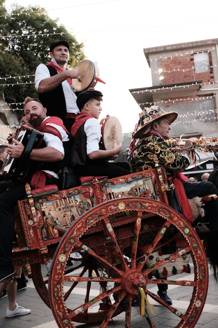 Vibrant scene of musicians playing instruments on a decorated cart in a Sicilian festival in Motta Camastra.